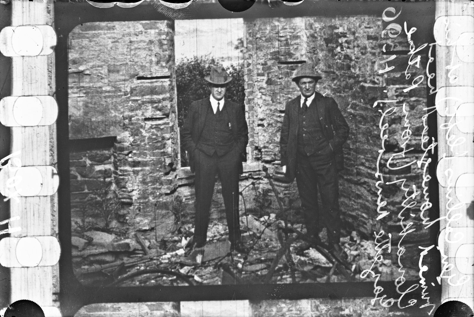 Michael Collins in earlier times, visits the burned-out ruins of the family home at Woodfield. He returned briefly on 22 August (Pic: National Library of Ireland)