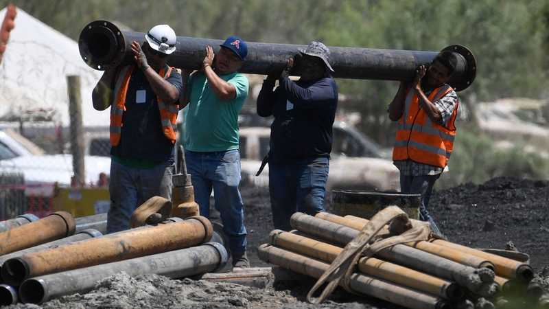Rescuers continued today to try and reach 10 miners trapped in a flooded coal mine in Mexico