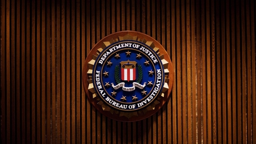 The suspect fled after armed FBI agents responded