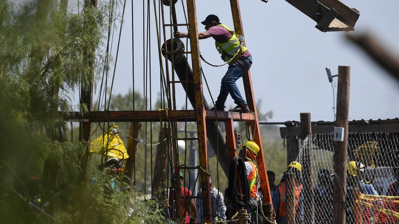Rescue teams today pictured attempting again to reach 10 miners trapped in the mine