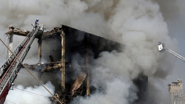 A rescue worker on the site of a retail market in the Armenian capital Yerevan