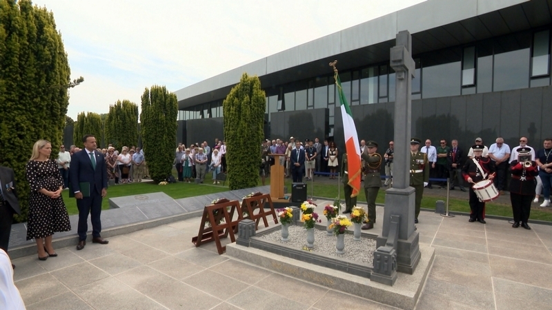 The national flag was raised and members of the men's families laid wreaths at their graves