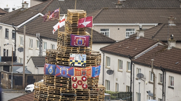 There was condemnation after the placing of poppy wreaths, flags and images on the bonfire