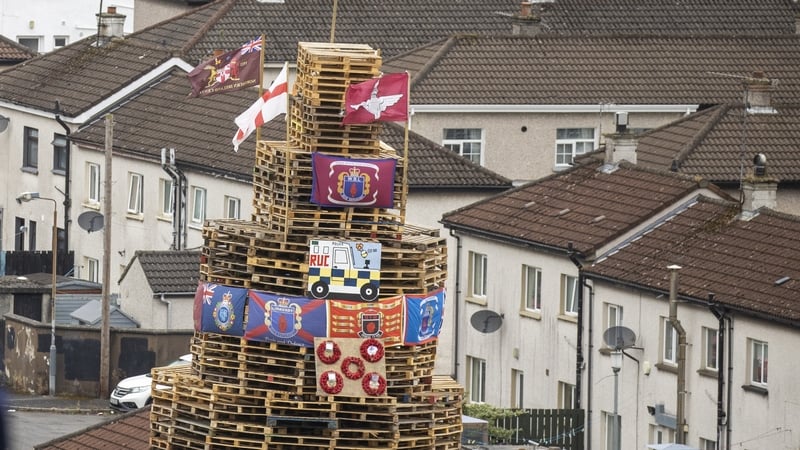 There was condemnation after the placing of poppy wreaths, flags and images on the bonfire