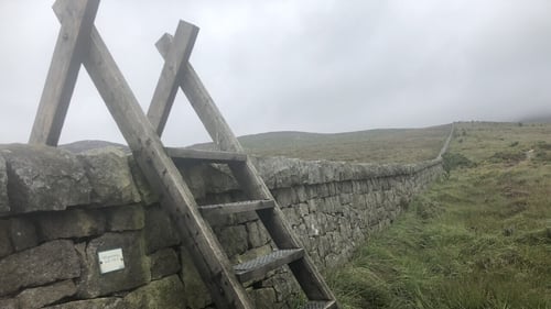 Stonemasons take a daily hike of up to 6kms to work on the wall