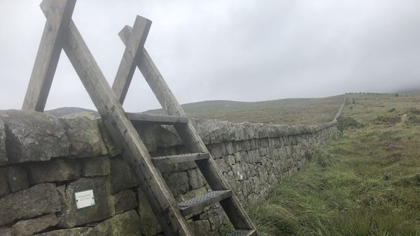 Stonemasons take a daily hike of up to 6kms to work on the wall