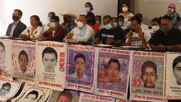 Relatives of the students of the Rural Normal School of Ayotzinapa who disappeared in 2014 are seen here addressing the media (file image)