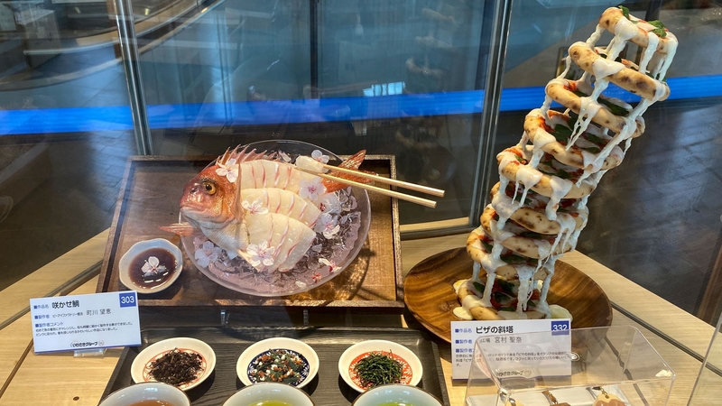 Sliced fish and a leaning tower of pizza are among the plastic food sculptures in Tokyo