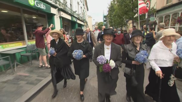 A parade, with many people wearing period dress, made its way through the main street, ending at Emmet Square