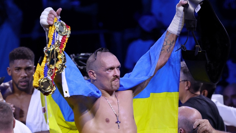 Oleksandr Usyk celebrates his triumph