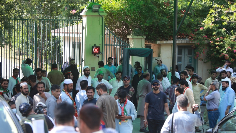 Supporters of former Pakistani Prime Minister Imran Khan gather outside his residence in Islamabad, Pakistan,