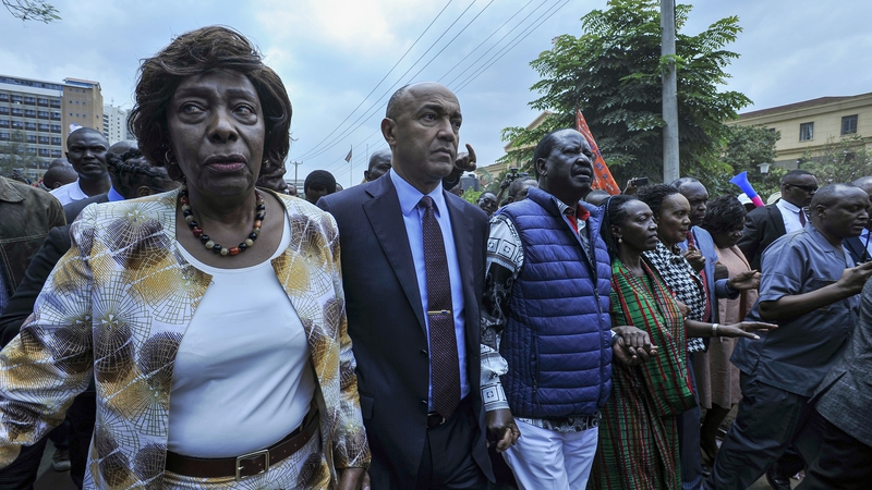 Raila Odinga, third from left, with supporters outside the Milimani High Court in Nairobi, Kenya
