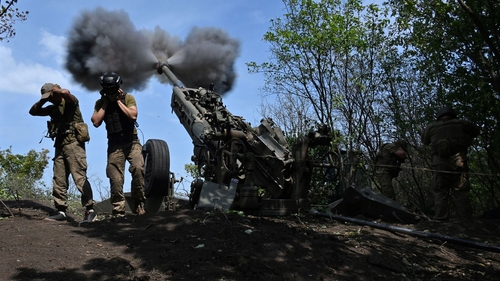 Ukrainian gunmen fire a US made M777 howitzer in Kharkiv