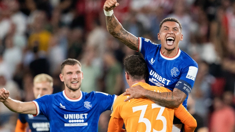 Rangers captain James Tavernier (right) leads the celebrations