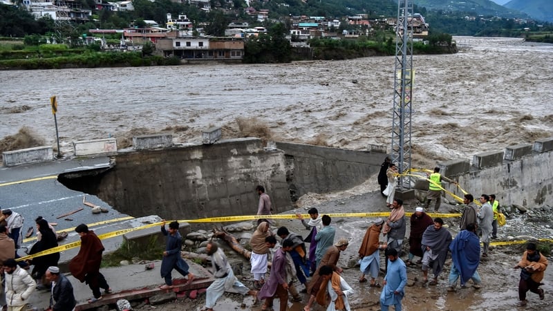 A road damaged by flood waters following monsoon rains in Pakistan's northern Swat Valley