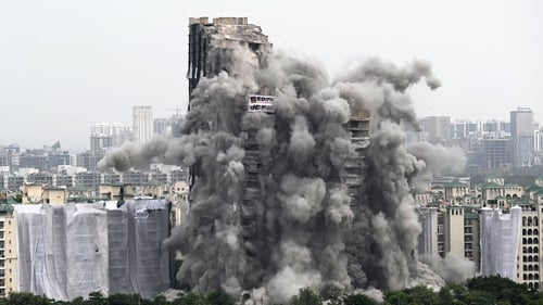 The two buildings came crashing down in seconds