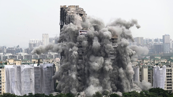 The two buildings came crashing down in seconds