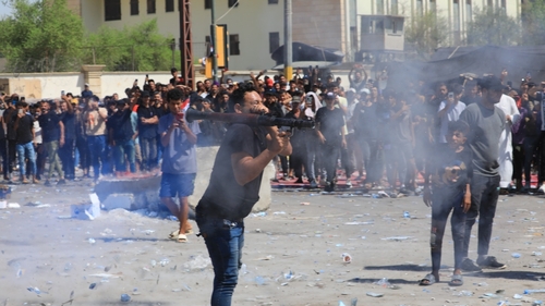 Supporters of Iraqi cleric Muqtada al-Sadr clash with security forces at Baghdad's Green Zone
