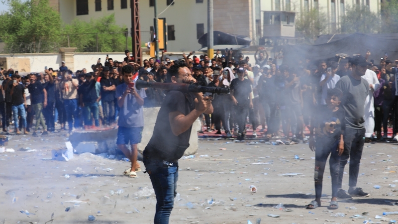 Supporters of Iraqi cleric Muqtada al-Sadr clash with security forces at Baghdad's Green Zone