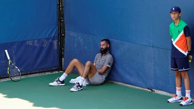 A dejected Benoit Paire retreated to the corner of the court when play was suspended for a fan to receive medical attention