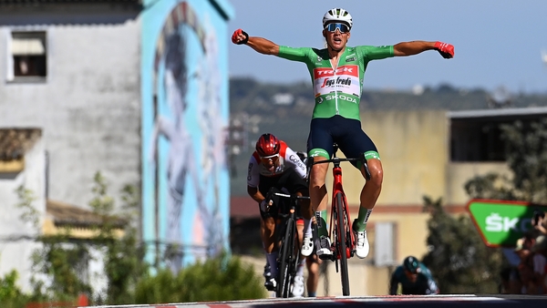 Mads Pedersen celebrates his stage victory as he crosses the line in Montilla