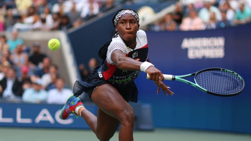Coco Gauff stretches to make a backhand return