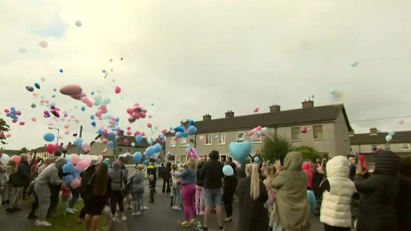 Balloons were released and candles lit in memory of the siblings