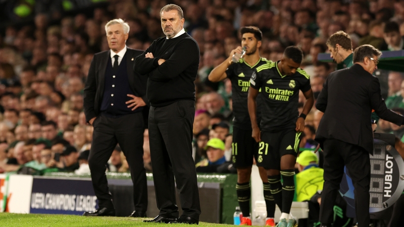Ange Postecoglou (C) and Carlo Ancelotti on the touchline