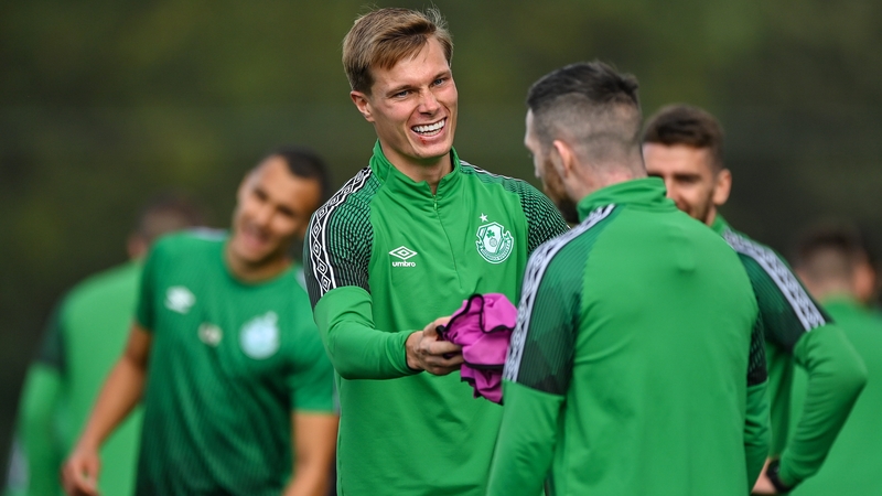 Dan Cleary shares a joke with Jack Byrne at a Shamrock Rovers training session ahead of the game