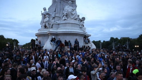 Crowds gather on the Victoria Memorial in front of Buckingham Palace following the death of Queen Elizabeth II