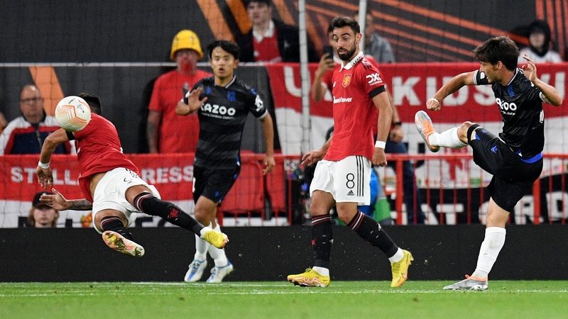 David Silva's (R) shot first hit Lisandro Martinez on the knee before the ball rebounded up onto his arm