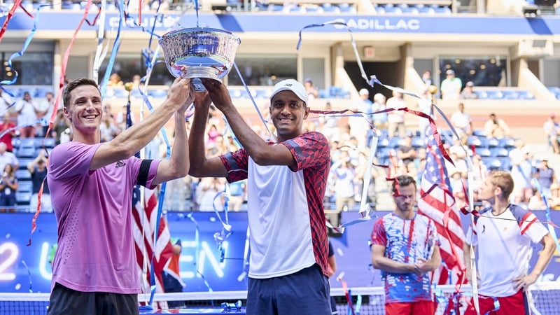 Rajeev Ram (R) of the United States and Joe Salisbury (L) of Great Britain celebrate with their trophy