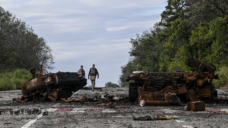 Destroyed armoured vehicles litter the road in Balakliia, in the Kharkiv region
