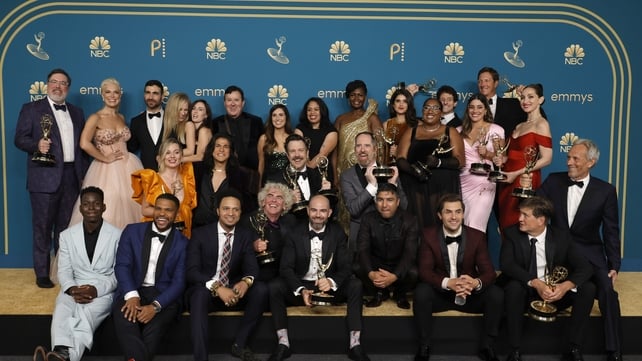 The cast and crew of Ted Lasso celebrating their Outstanding Comedy Series win