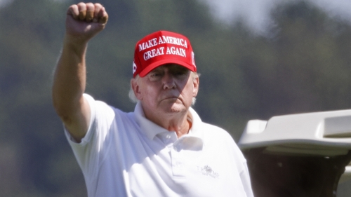 Former US President Donald Trump gestures while golfing at Trump National Golf Club last month