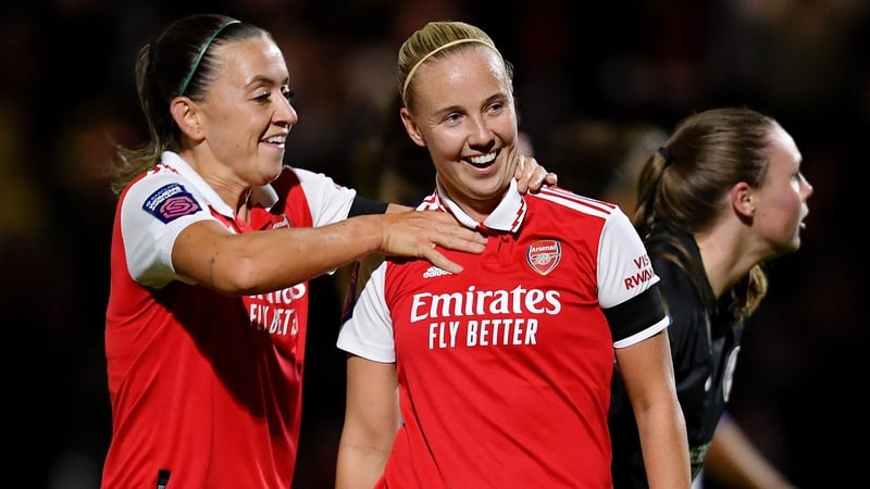 Katie McCabe (L) celebrates with Beth Mead