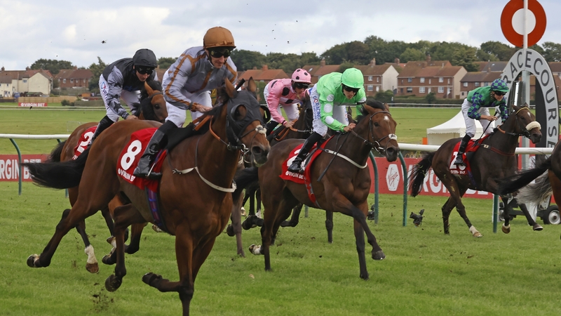 Summerghand (8) ridden by jockey Daniel Tudhop wins the Virgin Bet Ayr Gold Cup