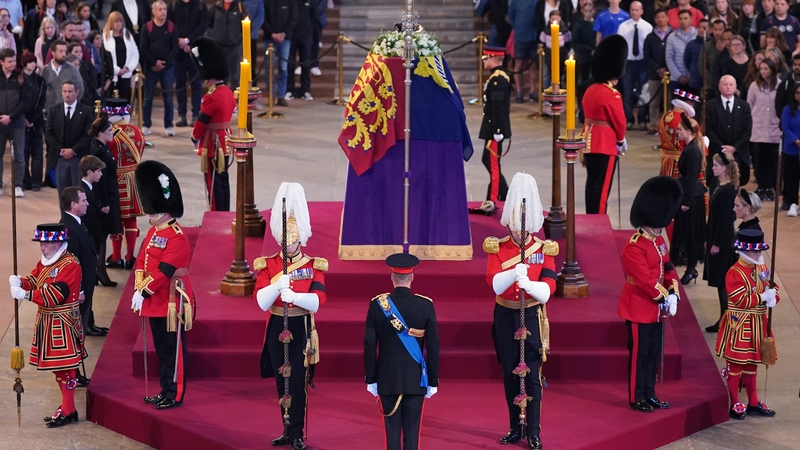 The grandchildren, aged from 44 to 14, stood silently with their eyes lowered as members of the public filed past