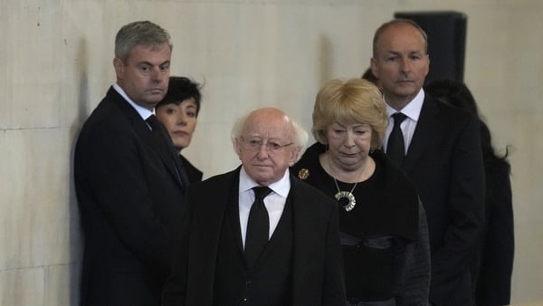 President Higgins, his wife Sabina and Micheál Martin pay their respects as they pass the coffin of Queen Elizabeth II