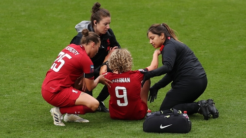 Leanne Kiernan of Liverpool receives medical treatment in the victory over Chelsea
