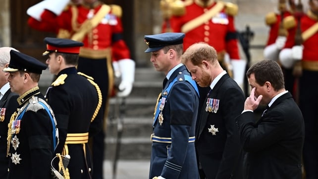 Princes William and Harry walk behind their grandmother's coffin in a procession through London (Marco Bertorello/AFP)