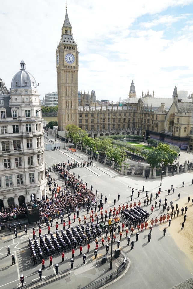 The queen's coffin is pulled through Westminster after her funeral service ended in the abbey (Stefan Rousseau/PA Wire/PA Images)
