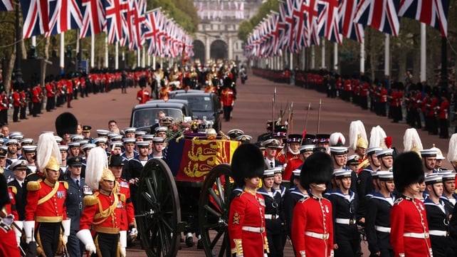 The queen's funeral cortège borne on the State Gun Carriage of the Royal Navy traveling along The Mall today in London (Peter Tarry - WPA Pool)