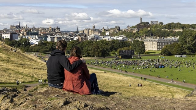 Crowds gather in Holyrood Park, Edinburgh, to watch the funeral of Queen Elizabeth on a large screen (Robert Perry/Getty)
