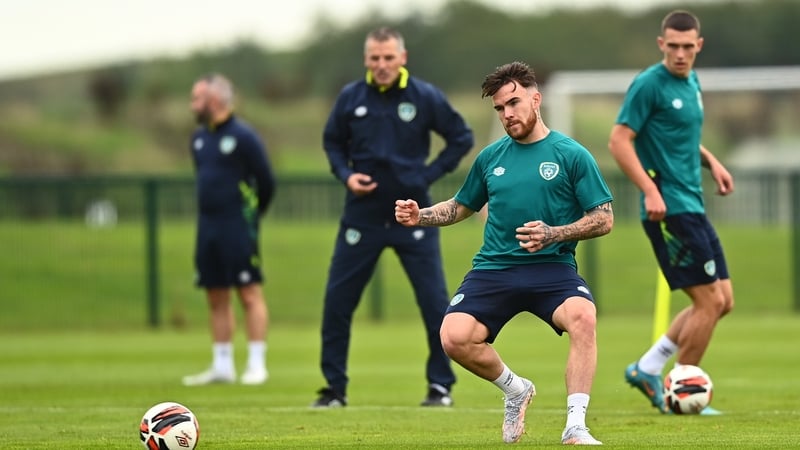 Jim Crawford looks on as Aaron Connolly trains with the U21 squad on Monday