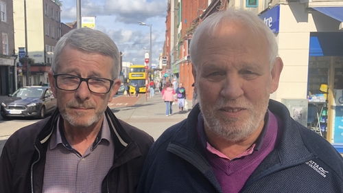 Noel Ryan (left) and Brian O'Grady talking to reporter Cathy Halloran in Limerick city today