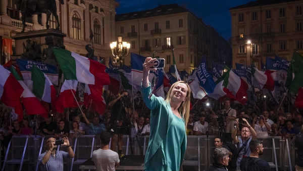 Giorgia Meloni takes a selfie with Brothers of Italy supporters at a rally in Turin. Photo: Nicolò Campo/LightRocket via Getty Images