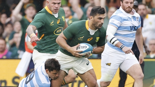 Damian de Allende is tackled by Argentina scrum-half Gonzalo Bertranou