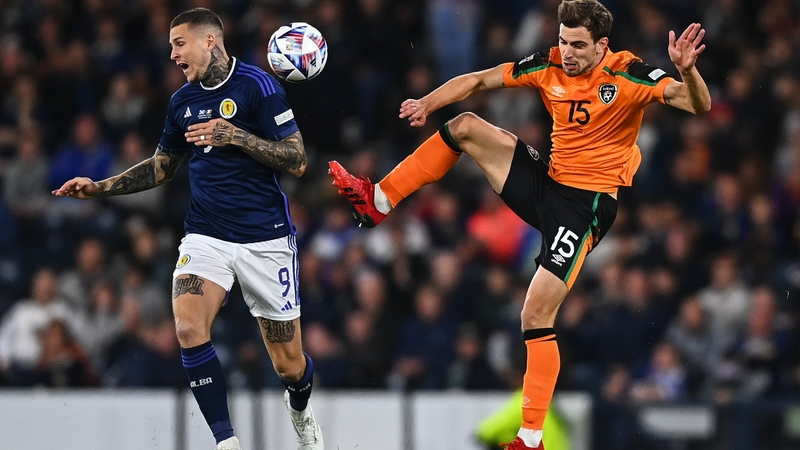 Molumby and Lyndon Dykes in the heat of battle at Hampden