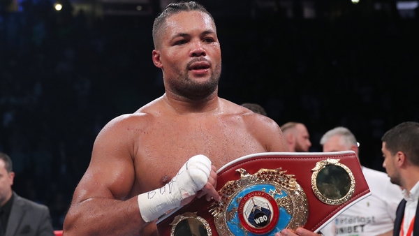 Joe Joyce celebrates with the vacant WBO Interim World Heavyweight Championship belt